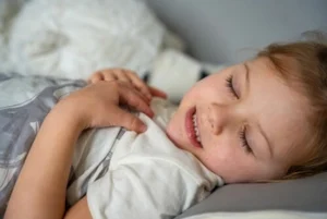 smiling child showing how teeth grinding happens smiling child showing how teeth grinding happens